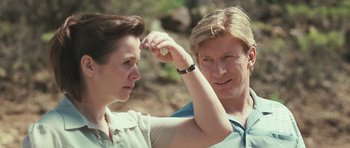 Movie still from “Oranges and Sunshine” (2010), directed by Jim Loach – A man and a woman standing next to each other outside; Close Up shot, Over the shoulder angle