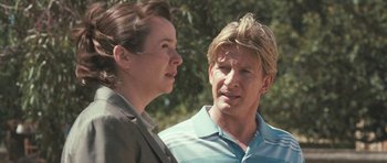 Movie still from “Oranges and Sunshine” (2010), directed by Jim Loach – A man and a woman standing next to each other outside; Close Up shot, Over the shoulder angle