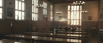 Movie still from “Oranges and Sunshine” (2010), directed by Jim Loach – A group of people sitting in a large room; Extreme Wide shot, High angle