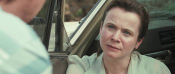Movie still from “Oranges and Sunshine” (2010), directed by Jim Loach – A person sitting in a car looking at the camera; Close Up shot, Over the shoulder angle