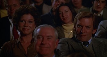 Movie still from “Ordinary People” (1980), directed by Robert Redford – A group of people sitting in a crowd watching a show; Close Up shot, High angle