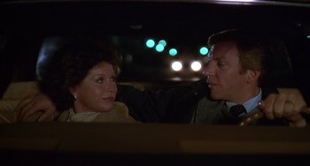 Movie still from “Ordinary People” (1980), directed by Robert Redford – A man and a woman sitting in the back of a car; Close Up shot, Over the shoulder angle