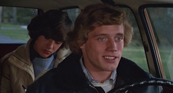 Movie still from “Ordinary People” (1980), directed by Robert Redford – A man sitting in the driver's seat of a car while a woman sits in the passenger's seat; Close Up shot, Over the shoulder angle