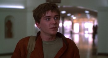 Movie still from “Ordinary People” (1980), directed by Robert Redford – A man with a brown jacket and a brown backpack; Close Up shot, Over the shoulder angle