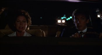 Movie still from “Ordinary People” (1980), directed by Robert Redford – A man and a woman sitting in the back of a car; Close Up shot, Over the shoulder angle