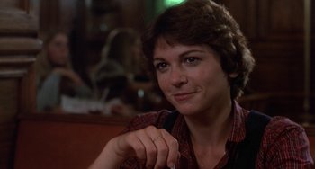Movie still from “Ordinary People” (1980), directed by Robert Redford – A person sitting at a table; Close Up shot, Over the shoulder angle