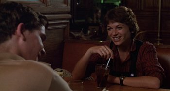 Movie still from “Ordinary People” (1980), directed by Robert Redford – A woman sitting at a table in front of a man; Close Up shot, Over the shoulder angle