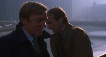 Movie still from “Ordinary People” (1980), directed by Robert Redford – Two men talking to each other in the dark; Close Up shot, Over the shoulder angle