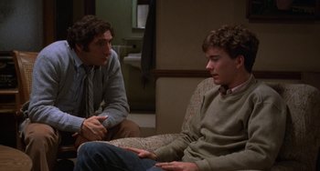 Movie still from “Ordinary People” (1980), directed by Robert Redford – Two men sitting on a couch talking to each other; Medium shot, Over the shoulder angle