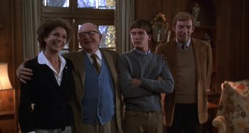 Movie still from “Ordinary People” (1980), directed by Robert Redford – A group of people standing next to each other in front of a window; Medium shot, Low angle