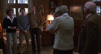 Movie still from “Ordinary People” (1980), directed by Robert Redford – An older woman is playing a video game while two others look on; Medium shot, Over the shoulder angle