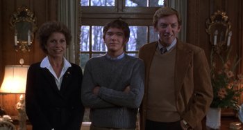 Movie still from “Ordinary People” (1980), directed by Robert Redford – A group of people standing next to each other in front of a window; Medium shot, Low angle