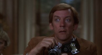 Movie still from “Ordinary People” (1980), directed by Robert Redford – A person holding a camera; Close Up shot, Low angle