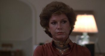 Movie still from “Ordinary People” (1980), directed by Robert Redford – A person wearing a red shirt; Close Up shot, Over the shoulder angle