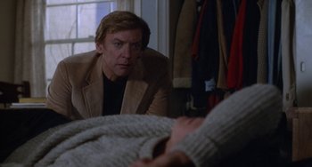 Movie still from “Ordinary People” (1980), directed by Robert Redford – A man looking at himself in the mirror; Medium shot, Over the shoulder angle