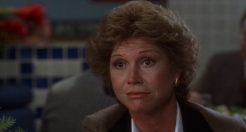 Movie still from “Ordinary People” (1980), directed by Robert Redford – A person wearing a suit and tie; Close Up shot, Over the shoulder angle