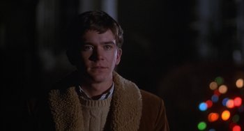 Movie still from “Ordinary People” (1980), directed by Robert Redford – A young man wearing a sweater and a brown jacket; Close Up shot, Over the shoulder angle