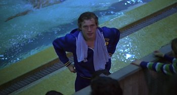 Movie still from “Ordinary People” (1980), directed by Robert Redford – A young man in a swimming pool with a towel around his neck; Medium shot, Over the shoulder angle
