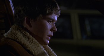 Movie still from “Ordinary People” (1980), directed by Robert Redford – A young man with a towel around his neck; Close Up shot, Over the shoulder angle