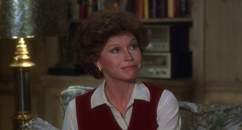 Movie still from “Ordinary People” (1980), directed by Robert Redford – A person sitting in a chair; Close Up shot, High angle