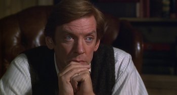 Movie still from “Ordinary People” (1980), directed by Robert Redford – A person sitting with his hand on his chin; Close Up shot, High angle