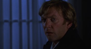 Movie still from “Ordinary People” (1980), directed by Robert Redford – A person wearing a suit and tie; Close Up shot, Over the shoulder angle