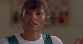 Movie still from “Original Gangstas” (1996), directed by Larry Cohen – A person wearing a white shirt; Close Up shot, Low angle