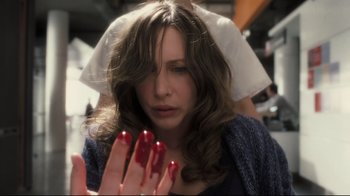 Movie still from “Orphan” (2009), directed by Jaume Collet-Serra – A woman with red fingernails and a veil on her head; Close Up shot, High angle