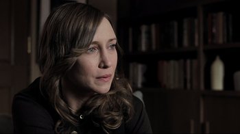 Movie still from “Orphan” (2009), directed by Jaume Collet-Serra – A person sitting in a room; Close Up shot, Over the shoulder angle