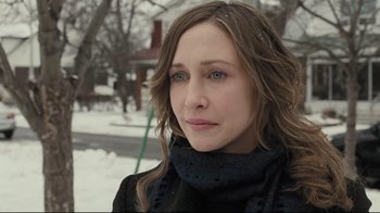 Movie still from “Orphan” (2009), directed by Jaume Collet-Serra – A person wearing a scarf; Close Up shot, Over the shoulder angle
