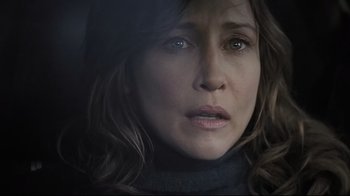 Movie still from “Orphan” (2009), directed by Jaume Collet-Serra – A woman's face in the dark; Close Up shot, Over the shoulder angle