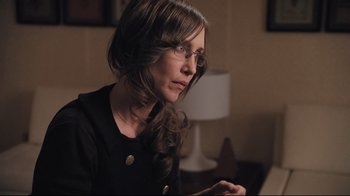 Movie still from “Orphan” (2009), directed by Jaume Collet-Serra – A woman with glasses looking at a laptop; Close Up shot, Over the shoulder angle