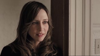 Movie still from “Orphan” (2009), directed by Jaume Collet-Serra – A person with long brown hair; Close Up shot, Over the shoulder angle