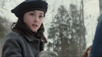 Movie still from “Orphan” (2009), directed by Jaume Collet-Serra – A young girl wearing a black hat and a coat; Close Up shot, Low angle
