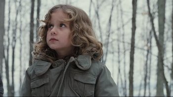 Movie still from “Orphan” (2009), directed by Jaume Collet-Serra – A little girl in a jacket looking up at the sky; Close Up shot, Low angle