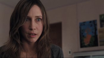 Movie still from “Orphan” (2009), directed by Jaume Collet-Serra – A person with long brown hair; Close Up shot, Over the shoulder angle