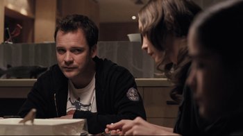 Movie still from “Orphan” (2009), directed by Jaume Collet-Serra – A man and a woman sitting at a dinner table; Medium shot, Over the shoulder angle