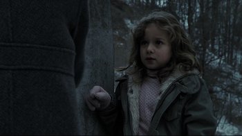 Movie still from “Orphan” (2009), directed by Jaume Collet-Serra – A little girl standing next to an older man; Close Up shot, Over the shoulder angle