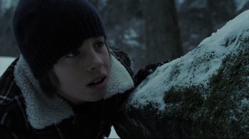 Movie still from “Orphan” (2009), directed by Jaume Collet-Serra – A young woman wearing a black jacket and a black hat; Close Up shot, Low angle