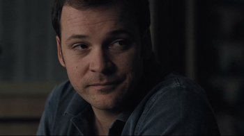 Movie still from “Orphan” (2009), directed by Jaume Collet-Serra – A person sitting in front of a window; Close Up shot, Over the shoulder angle