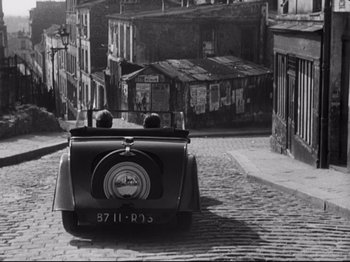 Movie still from “Orpheus” (1950), directed by Jean Cocteau – An old black and white photo of an old car; Extreme Wide shot, High angle