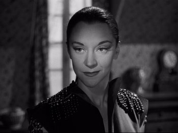 Movie still from “Orpheus” (1950), directed by Jean Cocteau – A black and white photo of a woman in a dress; Close Up shot, Over the shoulder angle