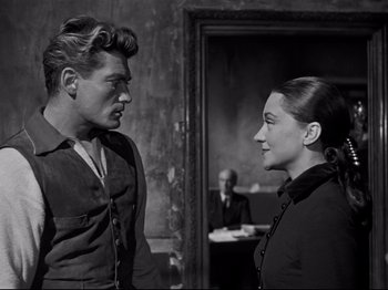 Movie still from “Orpheus” (1950), directed by Jean Cocteau – A black and white photo of a man and a woman; Medium shot, Over the shoulder angle