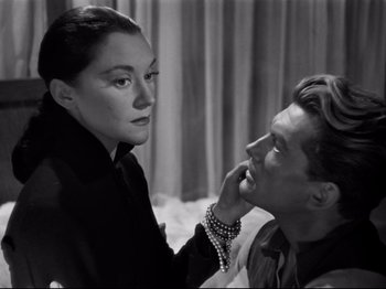 Movie still from “Orpheus” (1950), directed by Jean Cocteau – A man and a woman looking at each other; Close Up shot, Over the shoulder angle