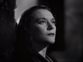 Movie still from “Orpheus” (1950), directed by Jean Cocteau – Black and white photograph of a woman looking up; Close Up shot, Low angle