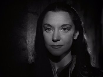 Movie still from “Orpheus” (1950), directed by Jean Cocteau – A black - and - white photo of a woman with long hair; Close Up shot, Low angle