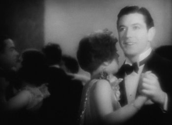 Movie still from “Our Dancing Daughters” (1928), directed by Harry Beaumont – A black and white photo of a man and a woman dancing; Close Up shot, Over the shoulder angle