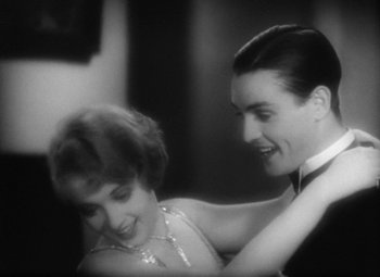 Movie still from “Our Dancing Daughters” (1928), directed by Harry Beaumont – A man and a woman dancing in a room together; Medium shot, Low angle