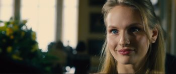 Movie still from “Our Kind of Traitor” (2016), directed by Susanna White – A woman's face in a living room; Close Up shot, Over the shoulder angle