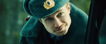 Movie still from “Our Kind of Traitor” (2016), directed by Susanna White – A person wearing a hat; Close Up shot, Low angle